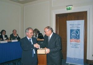 Hellenic Association of Travel & Tourism Agents' president, Yiannis Evangelou, hands over a special honor award to Dimitrios Pithis of Argo Travel for his decades of service to the Greek tourism sector. Argo Travel was first founded in 1953.