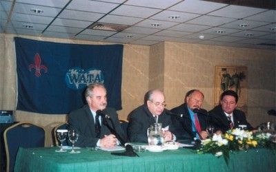 Yiannis Evagelou, president of the Hellinic Association of Travel and Tourism Agents; Ghassan Saad, president of the World Association of Travel Agents; Yiannis Patellis, president of the Hellenic Tourism Organization; and Vassilis Niadas, 2004 Games Support general manager.