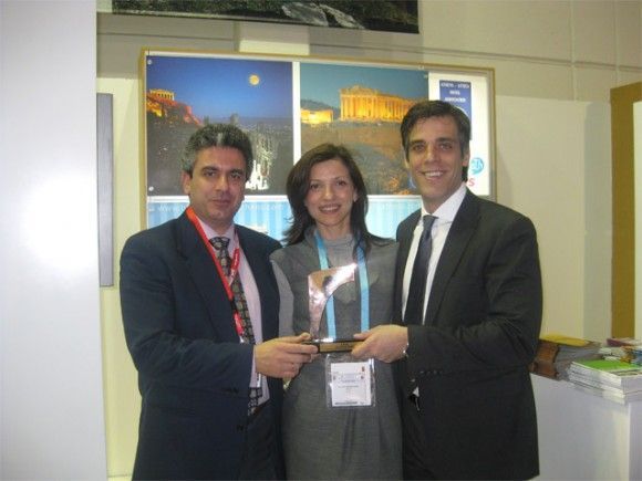 Pictured with the Golden City Gate award is Athens Convention Bureau Director, George Angelis; ATEDCo Public Relations Director Kalliopi Andriopoulou; and ATEDCo CEO Panagiotis Arkoumaneas.